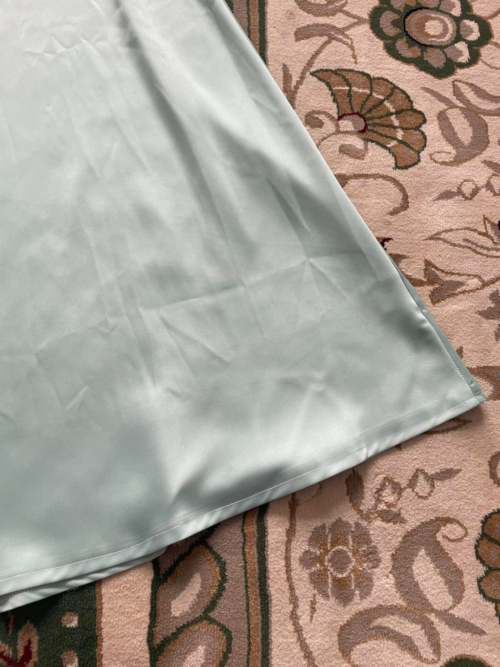 Light blue satin dress hem detail