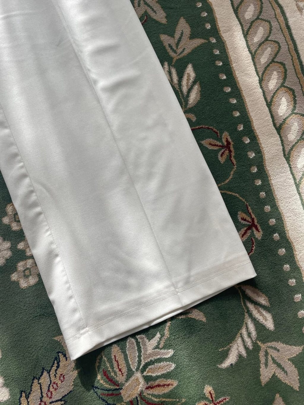 White trousers close-up stitching