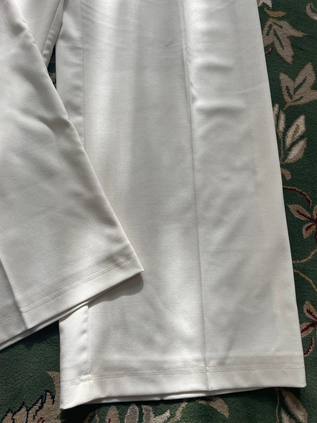 White trousers matching hem detail